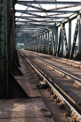 Image showing Empty railroad tracks on scale bridge