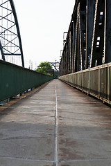 Image showing Empty railroad tracks on scale bridge