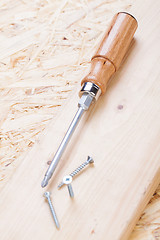 Image showing Phillips head screwdriver and wood screws