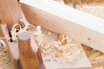 Image showing Handheld wood plane with wood shavings