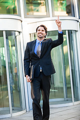 Image showing Motivated businessman punching the air