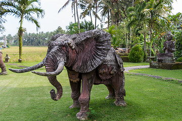 Image showing Elephant statue standing on a lawn at a park