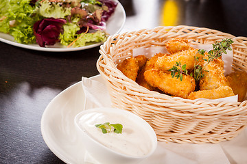 Image showing Crumbed chicken nuggets in a basket