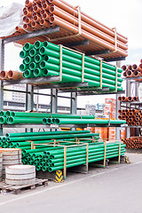 Image showing Plastic pipes in a factory or warehouse yard