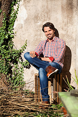 Image showing Male model sitting with legs crossed