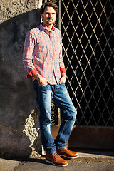 Image showing Male model leaning against wall