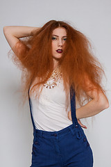 Image showing Female model playing with frizzy hair