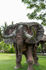 Image showing Elephant statue standing on a lawn at a park