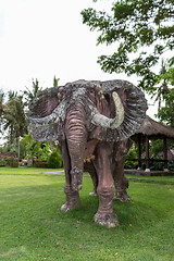 Image showing Elephant statue standing on a lawn at a park