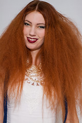 Image showing Female model playing with frizzy hair