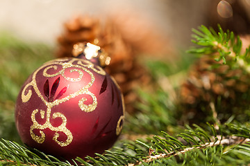 Image showing Red Christmas balls with pine cones