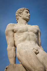 Image showing Bird perched on an ancient stone statue