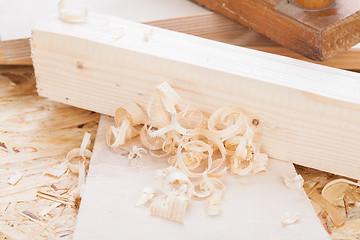 Image showing Handheld wood plane with wood shavings