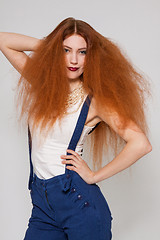 Image showing Female model playing with frizzy hair