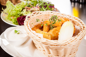 Image showing Crumbed chicken nuggets in a basket