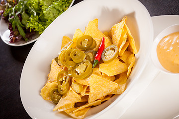 Image showing Nachos with cheese sauce and chilli pepperoni