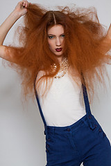 Image showing Female model playing with frizzy hair