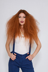 Image showing Female model playing with frizzy hair