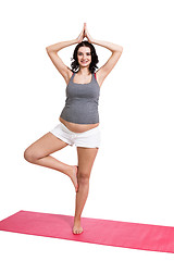 Image showing Active young pregnant woman doing yoga