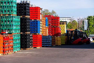 Image showing Stacks of beverage bottle crates