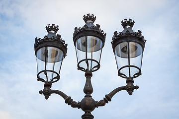 Image showing Old wrought iron lamp on a building exterior