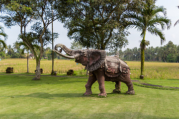 Image showing Elephant statue standing on a lawn at a park