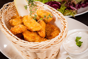 Image showing Crumbed chicken nuggets in a basket