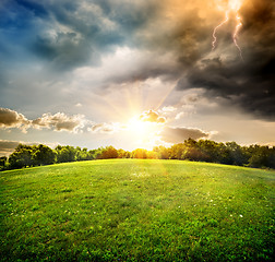 Image showing Bright lightning over field