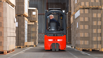 Image showing Forklift driving backwards