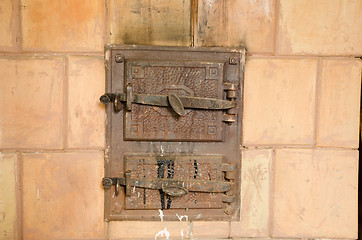 Image showing two closed old rustic furnace doors 