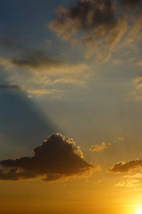 Image showing Rays of the setting sun illuminates the clouds