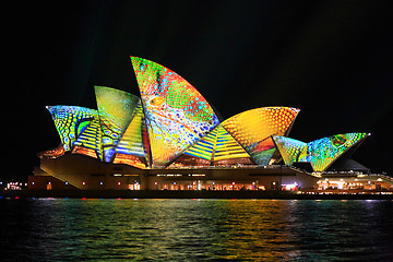 Image showing Opera house in summer colours of lime, aqua, yellow and orange