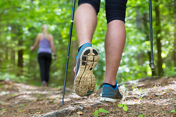 Image showing Young couple hiking in nature. Sport and exercise.