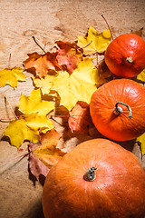 Image showing Pumpkins On Grunge Wooden Backdrop Background