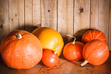 Image showing Pumpkins On Grunge Wooden Backdrop Background