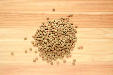 Image showing Green lentils on wood