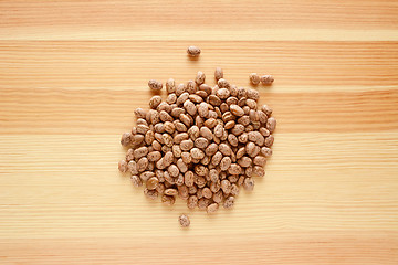 Image showing Pinto beans on wood