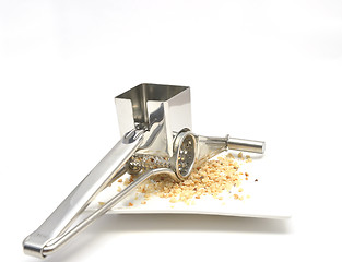 Image showing Grater with hazelnuts