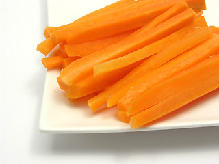 Image showing Julienne carrots on a white plate and white background
