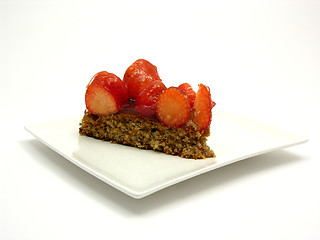 Image showing One slice of strawberry cake on white plate on white background