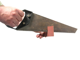 Image showing Cutout with hand and hand saw on white background