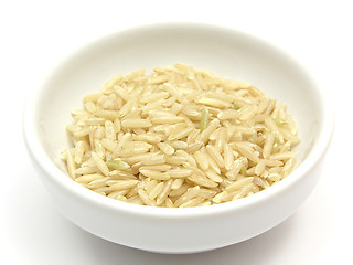 Image showing Brown rice in a bowl of chinaware on a white background