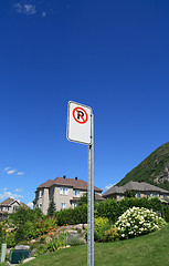 Image showing No parking sign in a rich suburban neighborhood