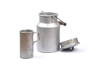 Image showing Graduated jug and milk can