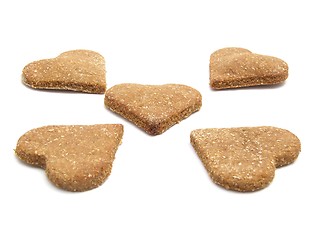 Image showing Selfmade christmas-cookies for dogs heart-shaped