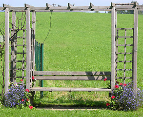 Image showing Wooden seating bench in the green in Freiland Austria