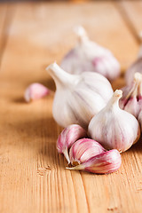 Image showing Raw Garlic On Wooden Background