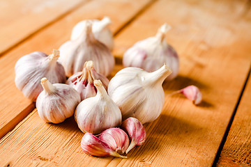 Image showing Raw Garlic On Wooden Background