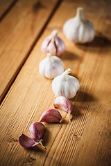 Image showing Raw Garlic On Wooden Background