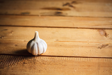 Image showing Raw Garlic On Wooden Background